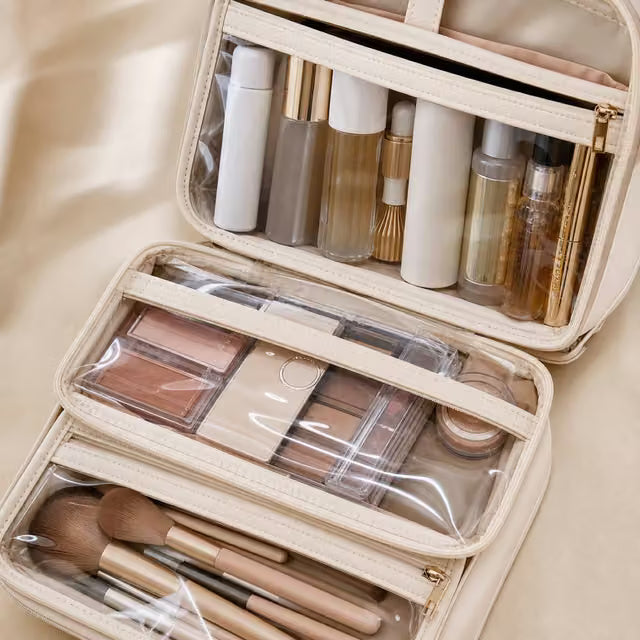 Transparent zippered dividers separating makeup, skincare and brushes