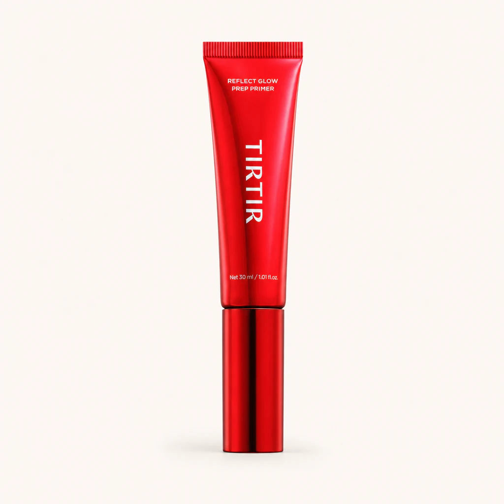 One complete red Reflect Glow Prep Primer tube on a clean warm background