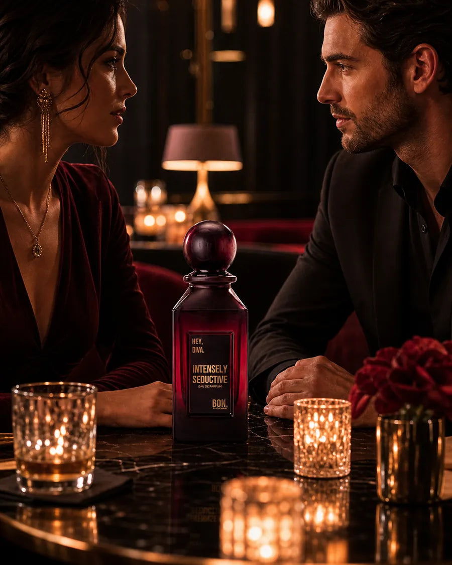 Two adults sharing a lingering look across a candlelit table with BON perfume