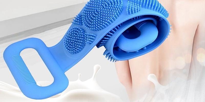 Blue silicone scrubber rolled to show its flexible shape