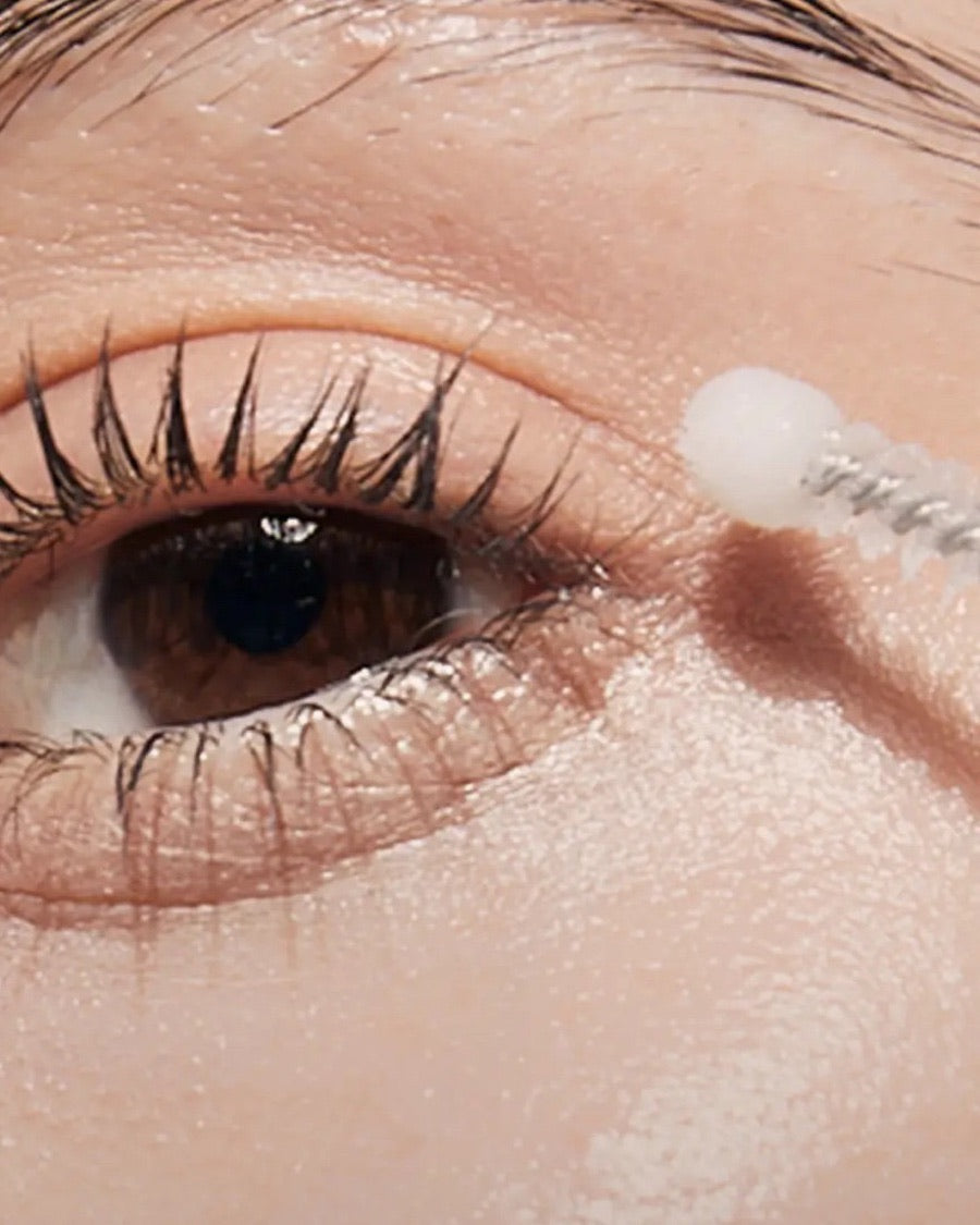 Close view of a curved applicator beside the eye area