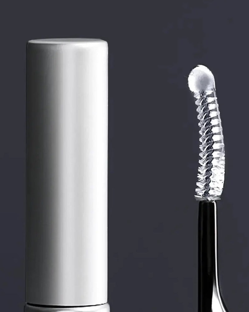 Silver serum tube and curved applicator on a dark background