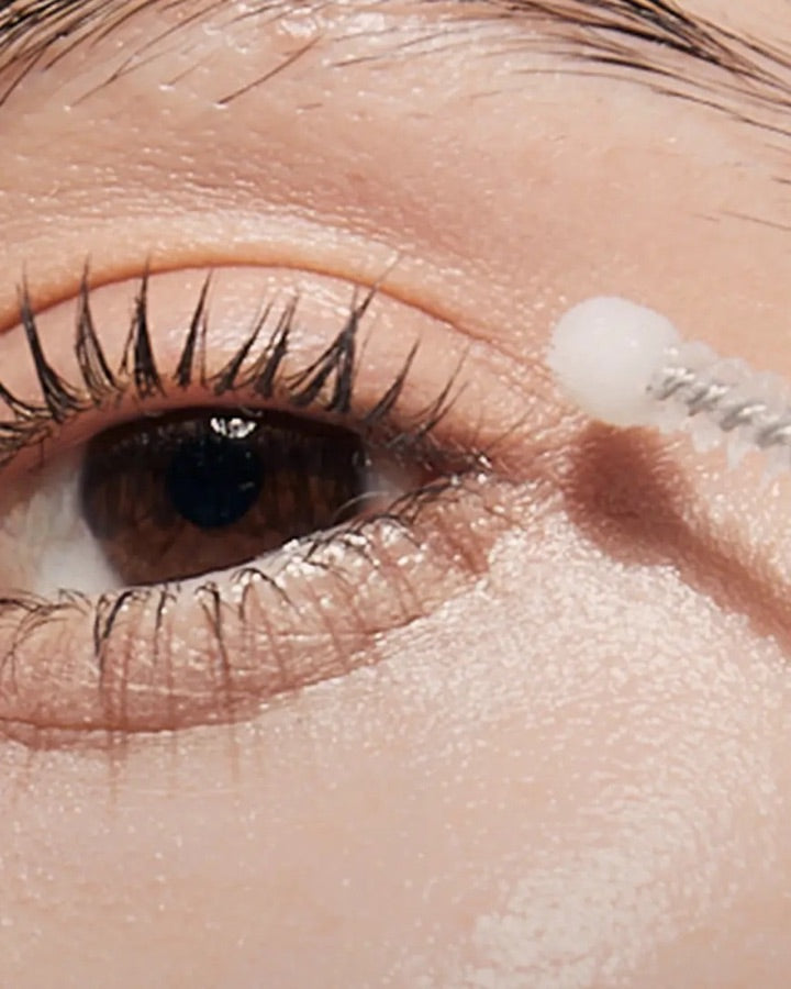 Close view of the curved applicator beside the eye area