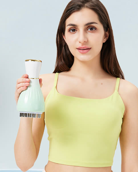 Person holding the compact handheld massager