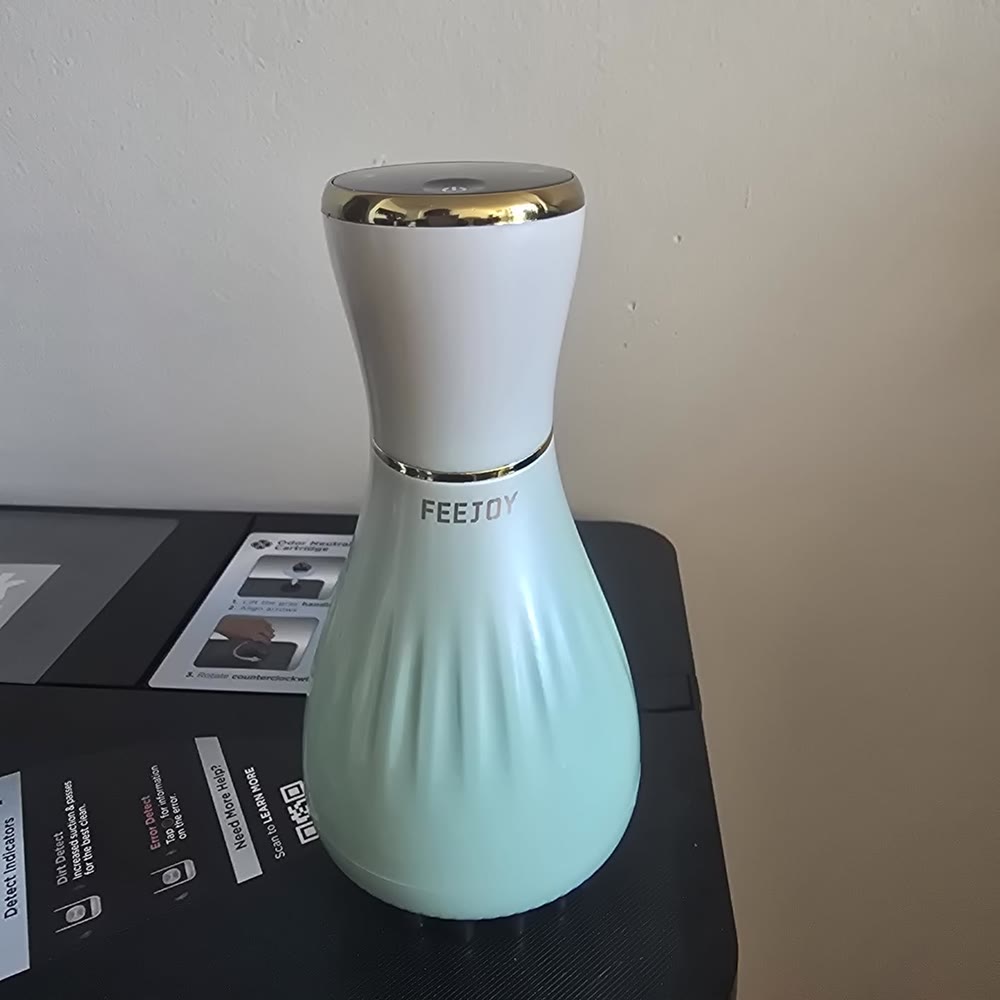 Real-world product photo of the handheld massager