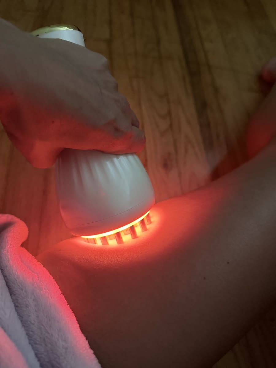 Customer photo using the massager on a leg