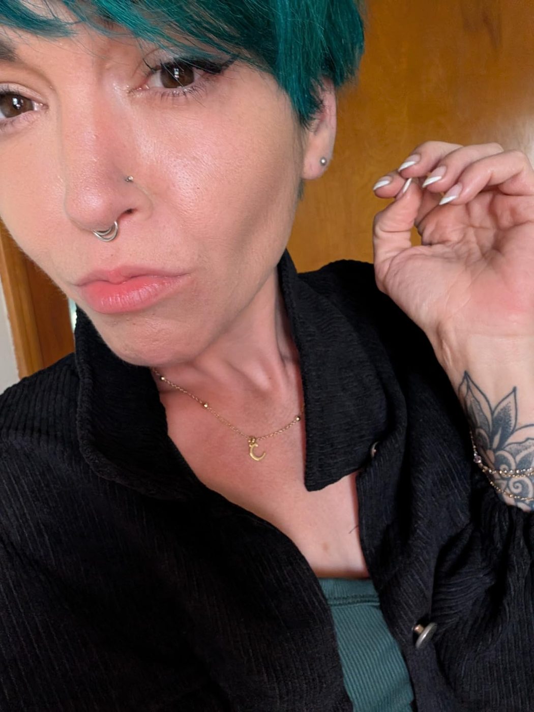 Customer selfie showing a finished winged eyeliner look.