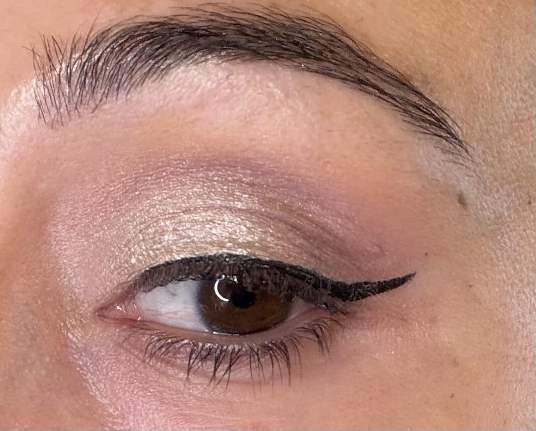 Close-up customer photo showing a sharp eyeliner flick.