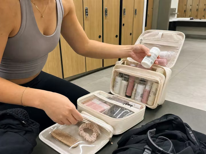 Beauty organizer open beside a gym bag