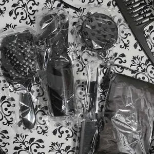 Customer-uploaded unboxing photo of the matching black hair-tool kit