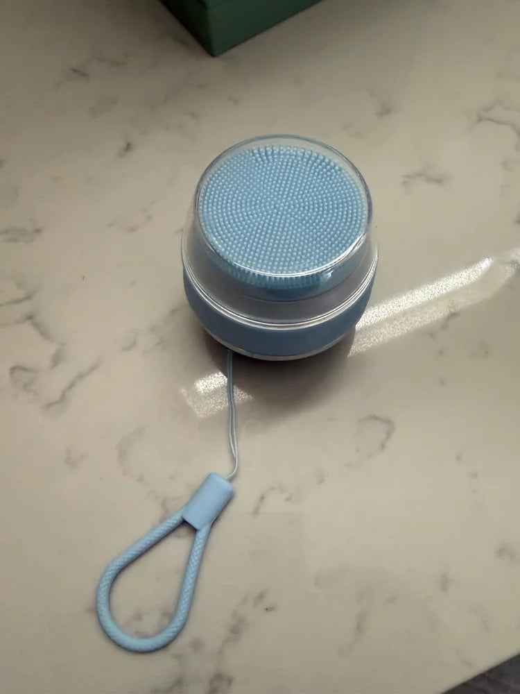 Buyer photo showing the same round silicone facial cleansing brush and its controls